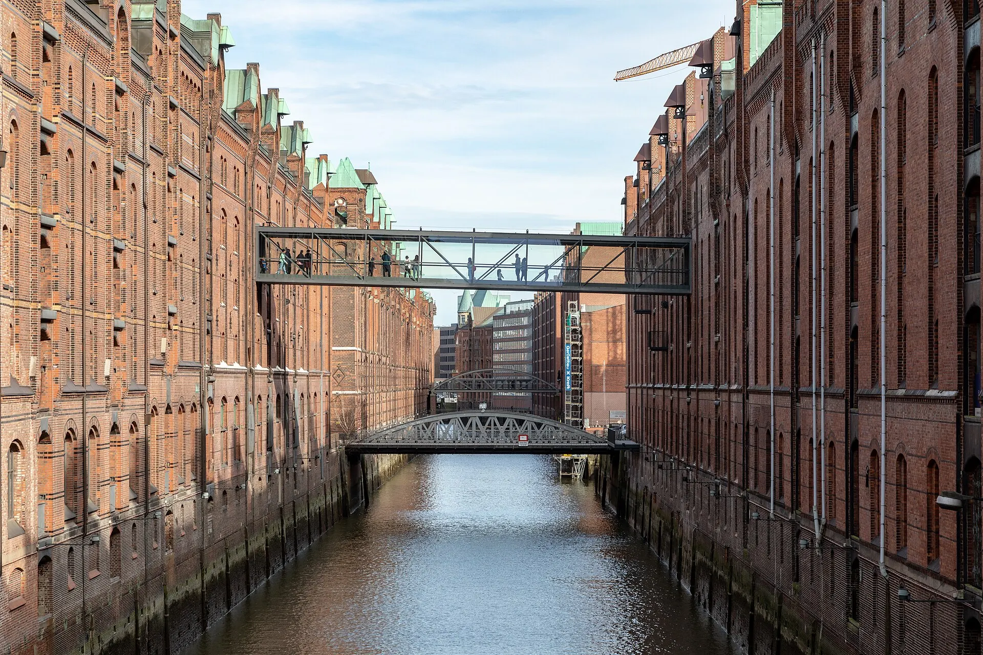 Block D (left) and Block L (right) with Sand Bridge in the Speicherstadt warehouse district in Hamburg, GermanyThe Speicherstadt was built between 1885 and 1927 as the world’s largest contiguous warehouse complex on…