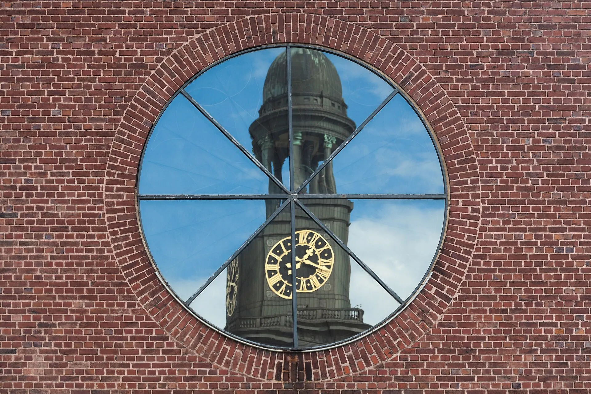 Reflection of St. Michaelis Church in a window of St. Ansgar in Hamburg, Germany.